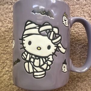 Halloween themed hello kitty mug
